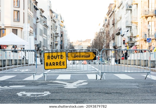 Route barree\
deviation translated as - closed street take other path - security\
gates over the main street in French city during the Christmas\
Market and other public\
event
