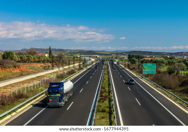 Route from Greece\
to Turkey. Greek Egnatia road with trucks and cars traffic. Greece,\
Evros, Alexandroupoli.