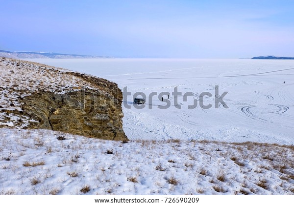 Route line on frozen lake BAIKAL from hilltop in
winter season, Russia