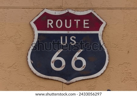 Route US 66 sign on the wall in Seligman, Arizona, USA.