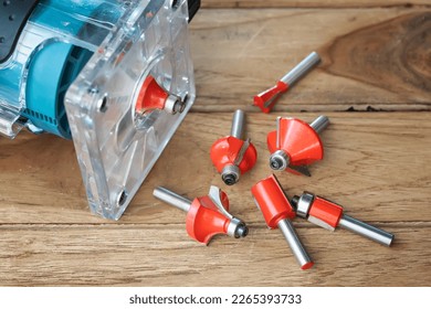 Router Bit and Trimmer router for Wood on wooden background, DIY maker and woodworking power tools concept. selective focus
