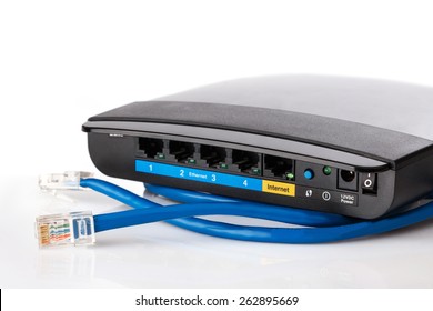 Router And Ethernet Cable On White Background