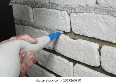 Routing Decorative Brick With White Cement Grout. Applying Grout With A Syringe.