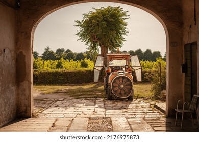 Rovigo, Italy 11 July 2022: Tractor In The Farm Shed In A Summer Sunny Day