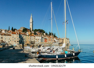 Rovinj,Istria,Croatia.View of the town situated on the coast of Adriatic Sea.Popular tourist resort and fishing port.Old town at sunrise with cobblestone streets, colorful houses and fishing boats