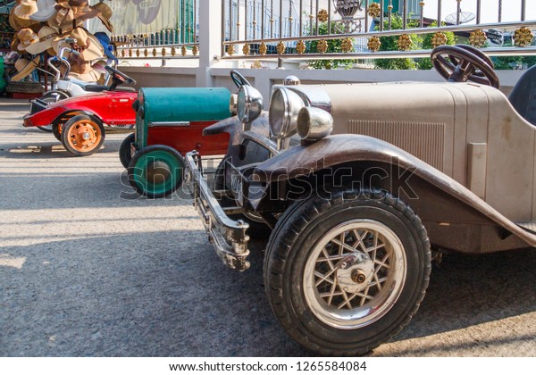 Row of antique pedal cars for sale, Damnoen\
Saduak, Thailand