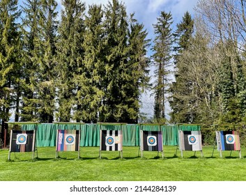 Row of archery targets on a field with forest in the background. High quality photo