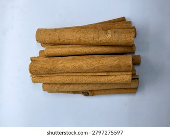 Row of aromatic dried cinnamon bark sticks spice dalchini 