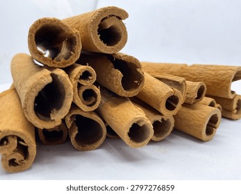 Row of aromatic dried cinnamon bark sticks spice dalchini 