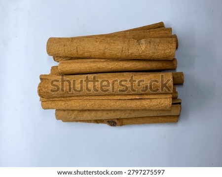 Row of aromatic dried cinnamon bark sticks spice dalchini 