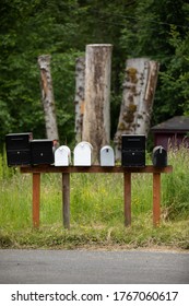 Row of assorted mailboxes with space for text on top and bottom