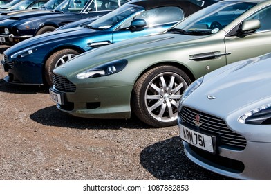 A row of Aston Martin sports cars.