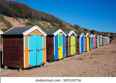 Row Of Beach Huts On Saunton Sands Holiday Resort In North Devon, UK