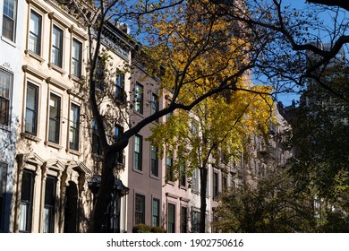 Row Of Beautiful Old Brownstone Homes On The Upper East Side Of New York City With Colorful Trees During Autumn