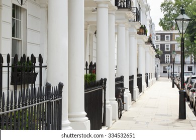 Row of beautiful white edwardian houses in Kensington, London 