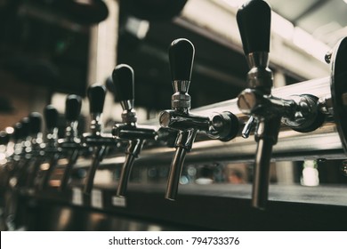 Row of Beer Taps in Pub