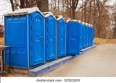 A row of bio toilets in public place