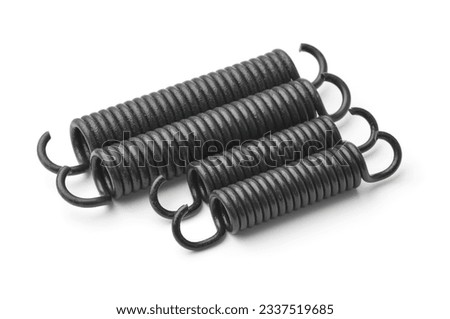 Row of black metal tension springs set isolated on white