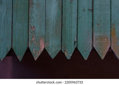 row of boards with triangular ends, blue boards. Old wooden boards, perfect background for your concept or project. green wooden fence close up. Old blue wooden facade made of sharpen timber boards. - Shutterstock ID 2205963733