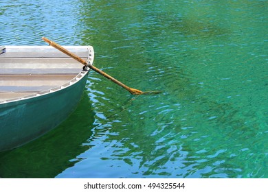 Row Boat With Oar At Clear Lake In Oregon