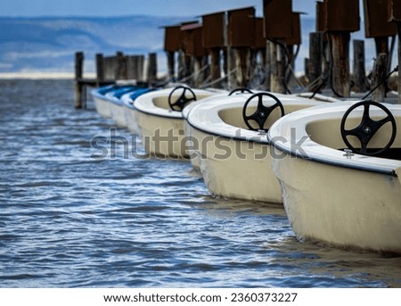Row of boats on the lake.