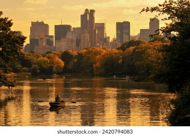 Row boats at sunset on a small lake at the Central Park, Upper West Side, New York City, NY, USA. - Powered by Shutterstock