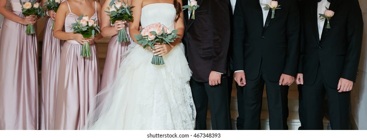 Row Of Bridesmaids And Groomsmen At Big Wedding Ceremony