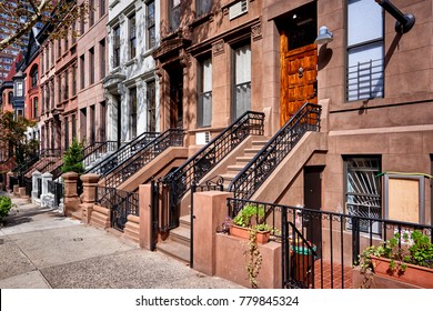 A Row Of Brownstone Buildings On A Sunny Summer Day In Brooklyn, New York City.