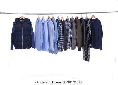 Row of business formal suit jacket , with striped ,blue shirt , plaid shirt ,with woman dress , on hanger  - Powered by Shutterstock