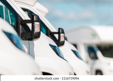 Row Of Camper Vans On The Recreational Vehicles Dealership Lot. RV Industry.