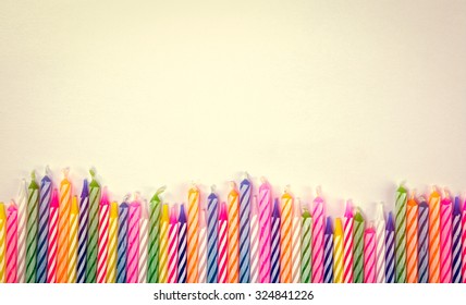 row of candles birthday on white paper background, vintage