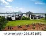 Row of canons display at historic Vicksburg battlefield overlooking old and new bridges across Mississippi River, artillery during siege of Vicksburg civil war, Mississippi, USA. Interstate 20, US 80