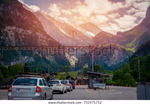 Row of cars to get in the car\
trains between Kandersteg and Goppenstein,\
Switzerland