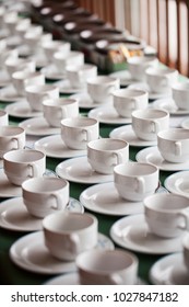 Row of ceramic white cup preparing coffee break