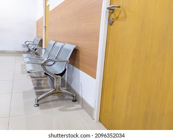 Row Of Chair In Doctor Waiting Room With No People.