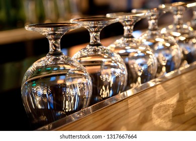 Row Of Clean Empty  Wine  Glasses Turn Upside Down On Counter Bar