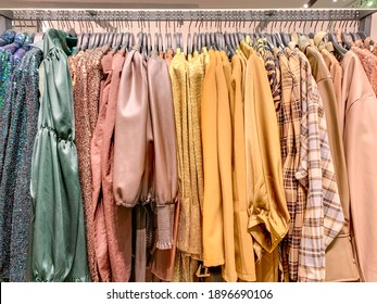 A Row Of Clothes Hanging On The Rack