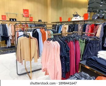 A Row Of Clothes Hanging On The Rack