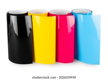 Row of CMYK colored vinyl car wrapping or plotter cutting sticker foil film rolls isolated on white banner background