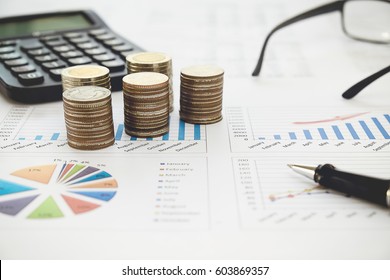 Row of coins,calculator with account book finance and banking concept for background.concept in grow and walk step by step for success in business. concept of saving money.