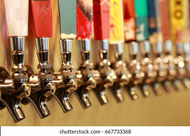 row of color full beer taps