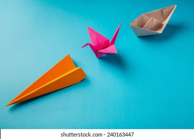 Row Of Colored Paper Origami Plane Crane, Boat