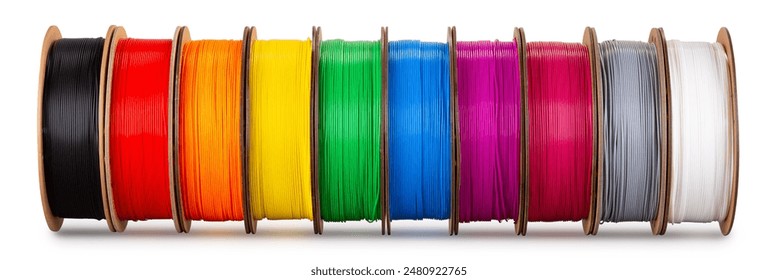row of colorful 3d printing filament PLA material on environmentally friendly and recyclable paper cardboard spools isolated on white background. modern FDM printer technology concept