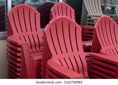 A Row Of Colorful Adirondack Chairs Red Outside Plastic