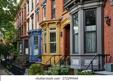 a row of colorful apartments in a big city - Powered by Shutterstock