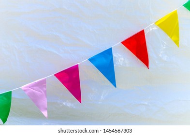 A Row Of Colorful Flags At A Village Fete In The UK