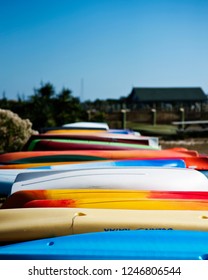 Row Of Colorful Kayaks And Small Boats In The Outer Banks North Carolina