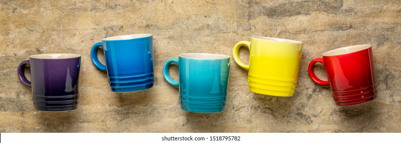 Row Of Colorful Stoneware Coffee Cups Against Textured Handmade Bark Paper, Cofee Break Concept, Long Banner