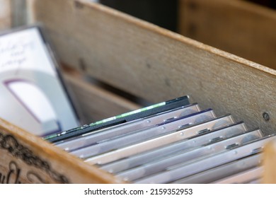 Row Of Compact Discs (CDs) For Sale Outside A Vintage Music Store.