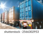 Row of Container Trucks on The Parking Lot. Cargo Container Shipping. Handling of Logistics Transportation Industry. Freight Truck Import-Export. Distribution Warehouse. Logistics Truck Transportation